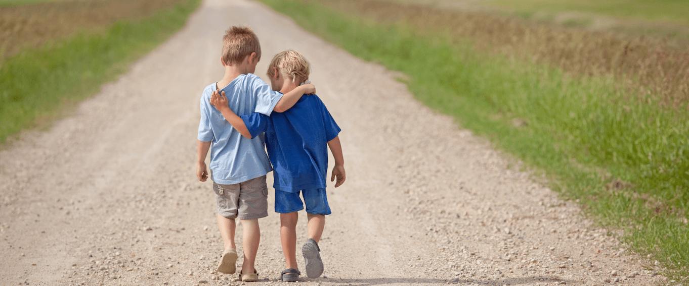 Two donor-conceived children walking in nature