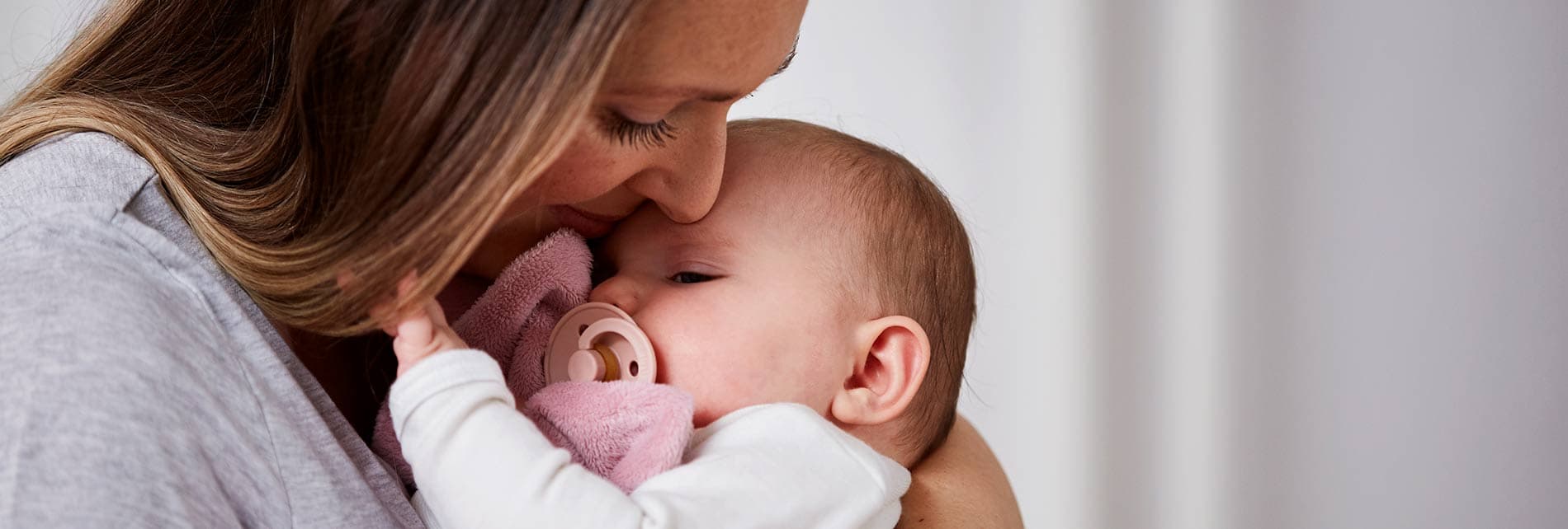 Mother with baby after fertility treatment with Cryos donor eggs