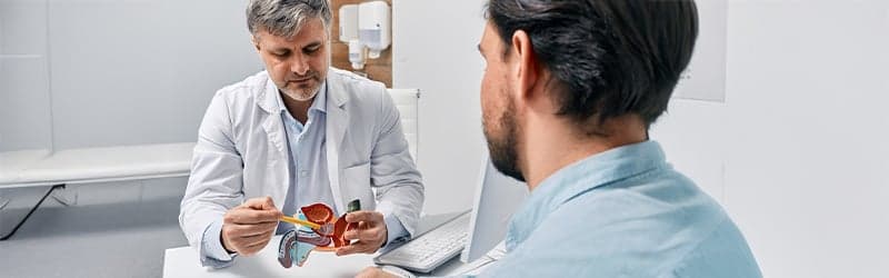 Man at the doctor struggling with varicocele Man at the doctor struggling with varicocele