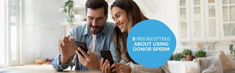 Two persons reading about using donor sperm Two persons reading about using donor sperm