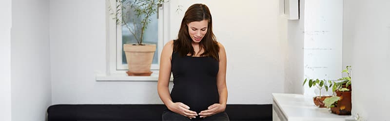 Pregnant woman thinking about what boosts the chances of having twins Pregnant woman thinking about what boosts the chances of having twins