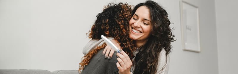 Two women in a relationship who are about to have a family Two women in a relationship who are about to have a family