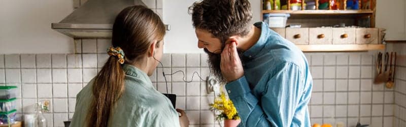 Couple struggling with infertility listening to a podcast Couple struggling with infertility listening to a podcast