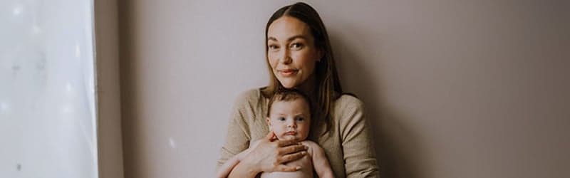Malene and her baby standing Malene and her baby standing
