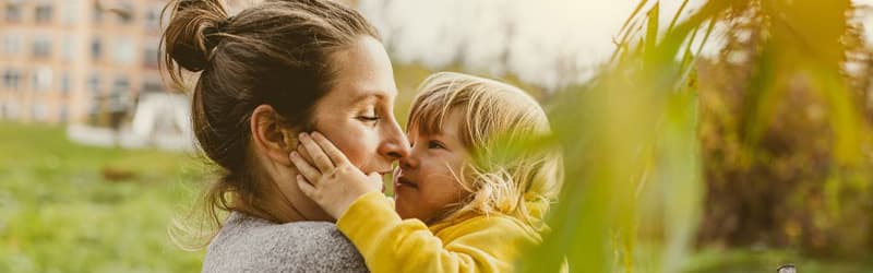 Woman and child hugging Woman and child hugging
