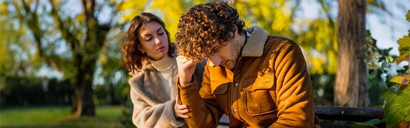 Woman comforting man struggling with infertility Woman comforting man struggling with infertility