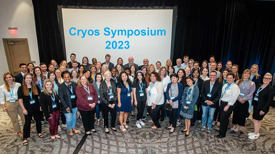 A group of people posing for a group photo at the Cryos Symposium 2023