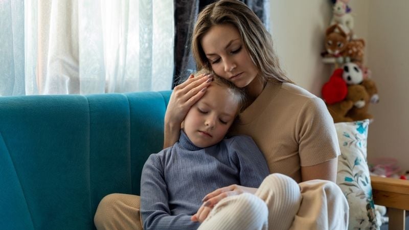 A mother to a child looking sad