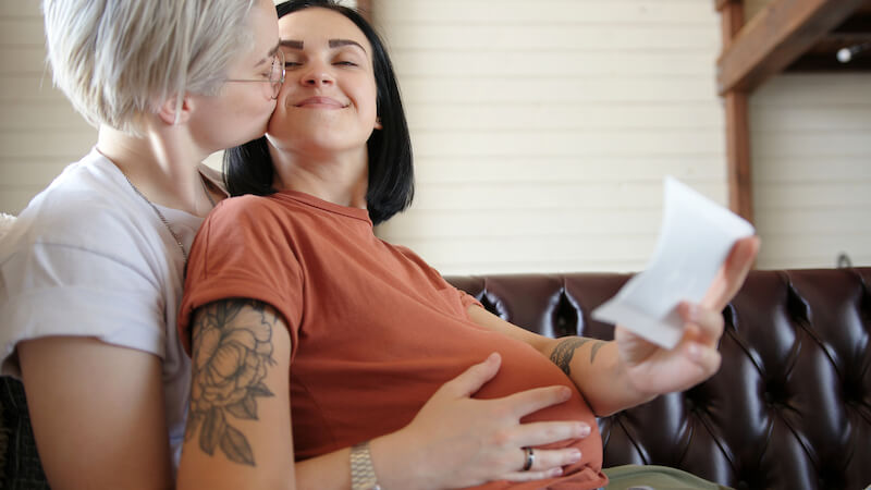 Women in a lesbian relationship must decide who will carry the baby. Some take turns to experience pregnancy