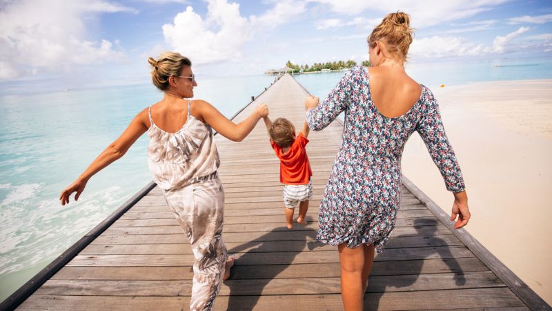 Lesbian couple on holiday with their donor-conceived child