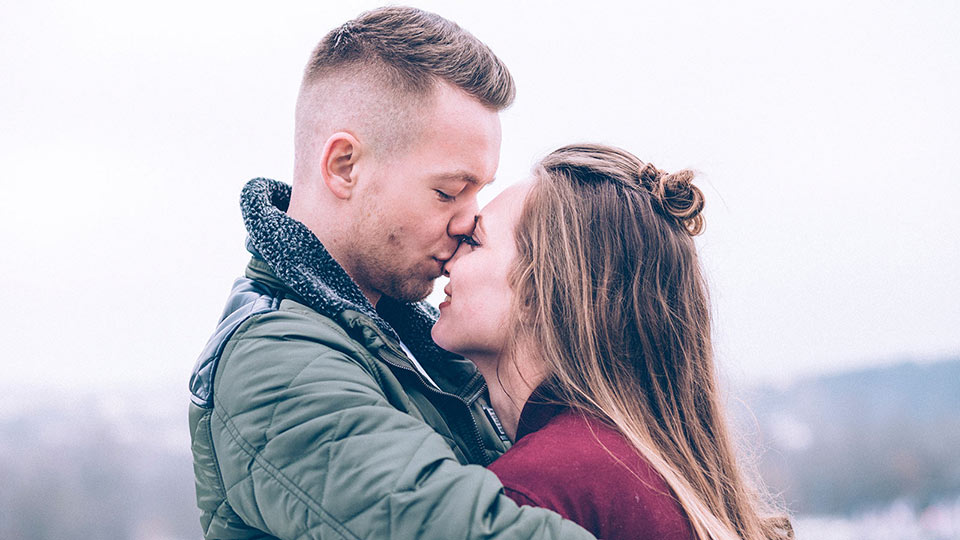 Infertile couple kissing and thinking about having a child by using donor sperm to conceive