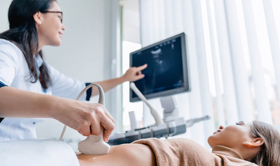 Woman having ultrasound during egg freezing process