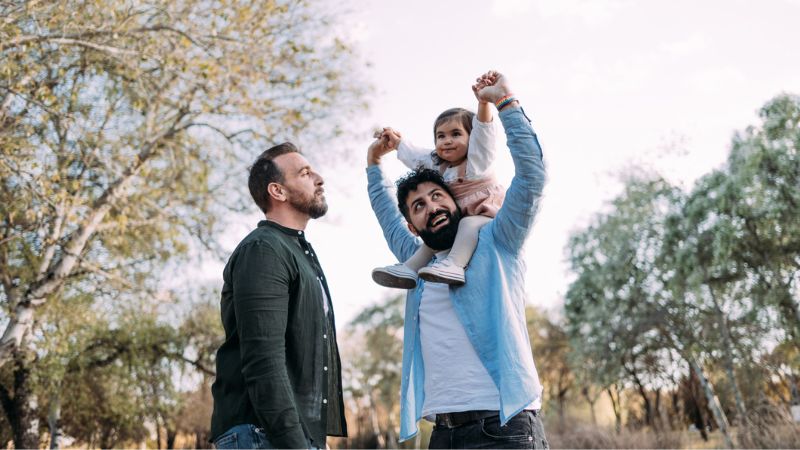 Gay couple with their donor-conceived child