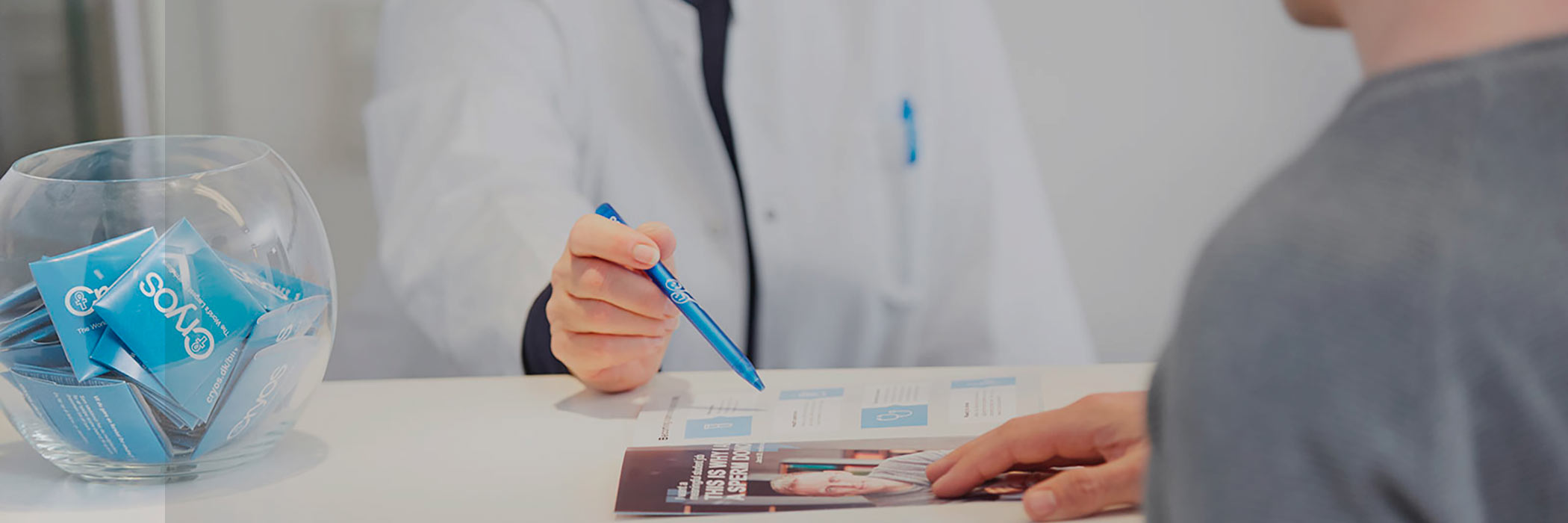 Cryos nurse and donor looking at pamplet
