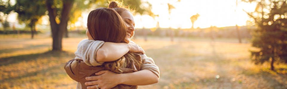 Thankful woman hugging egg donor