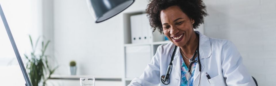 A smiling fertility doctor