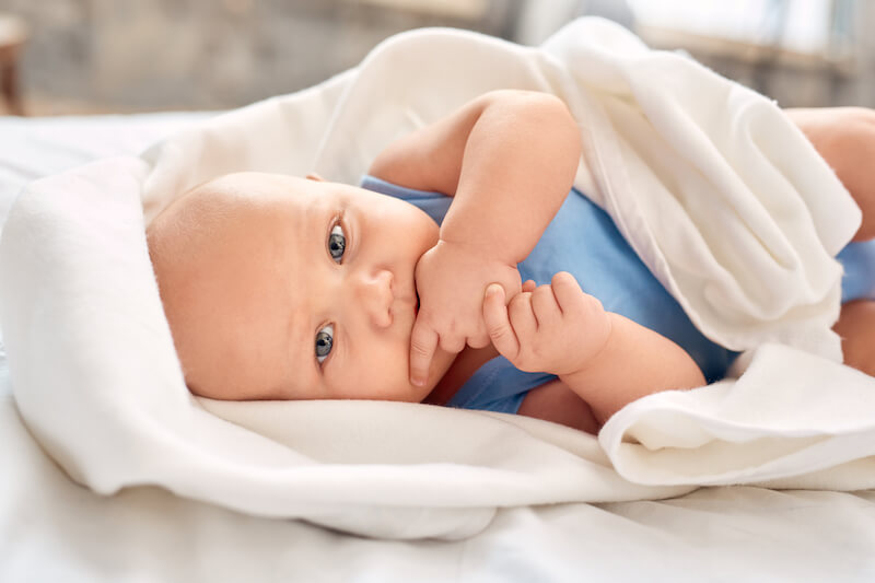 The eyes of newborn babies appear blue because there is no color on the retina