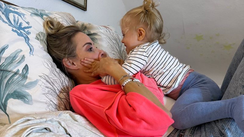 Sarah playing with her daughter Sarah playing with her daughter