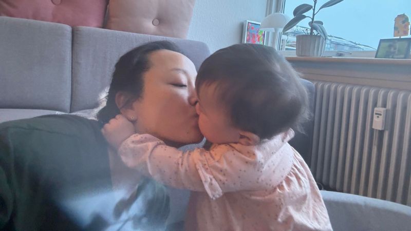 Lea kissing her child Lea kissing her child