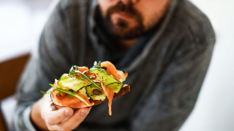 Man eating fish to improve his sperm quality Man eating fish to improve his sperm quality