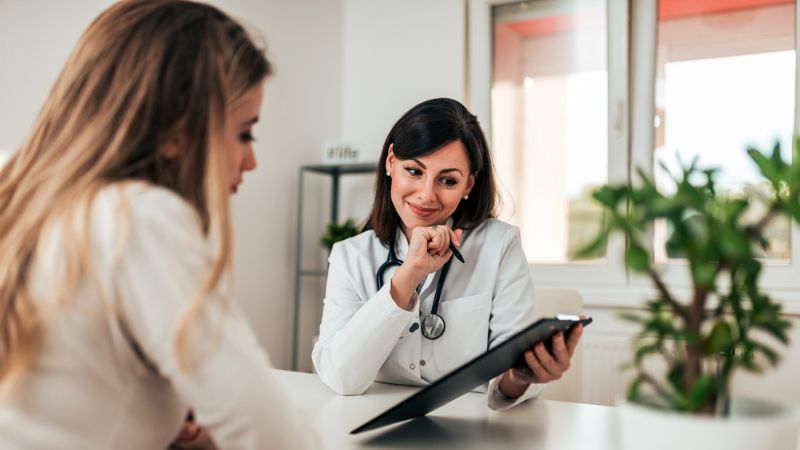 Future single mother receiving advice from her doctor on fertility treatment Future single mother receiving advice from her doctor on fertility treatment