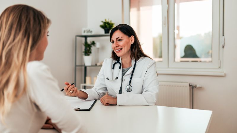 Woman receiving guidance in terms of IVF Woman receiving guidance in terms of IVF