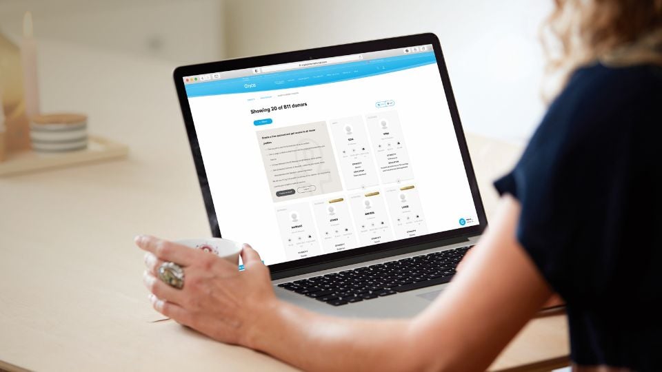 Woman looking at Sperm Donor Profiles at Cryos Woman looking at Sperm Donor Profiles at Cryos