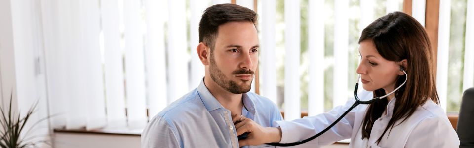 A doctor examines a patient
