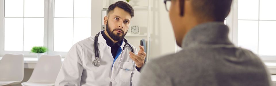 Man talking to a doctor Man talking to a doctor