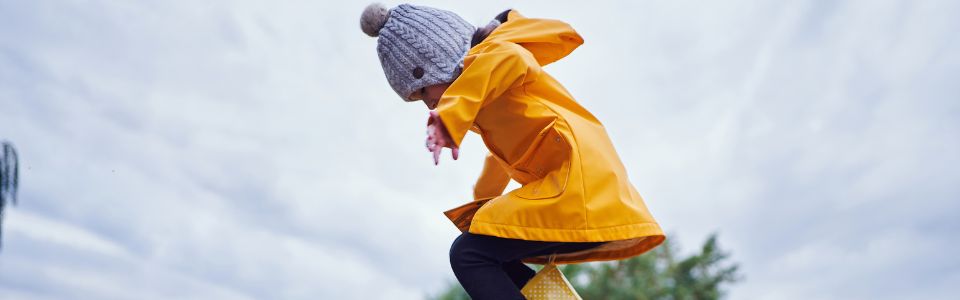 Donor-conceived child wearing a rain jacket