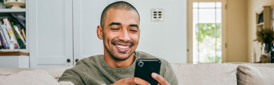 A potential sperm donor looking at his phone
