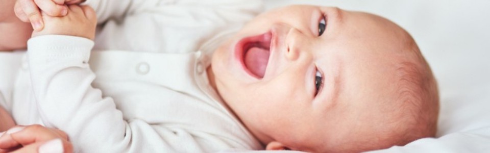 A happy baby laughing