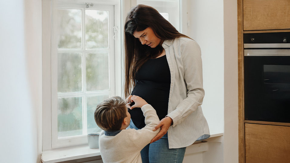 Pregnant woman with child Pregnant woman with child