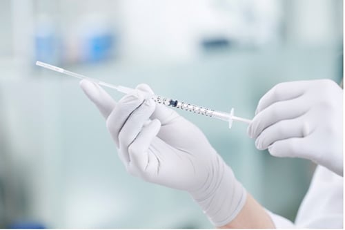 Emptying straw with high-quality sperm from Cryos into syringe for use in fertility treatment