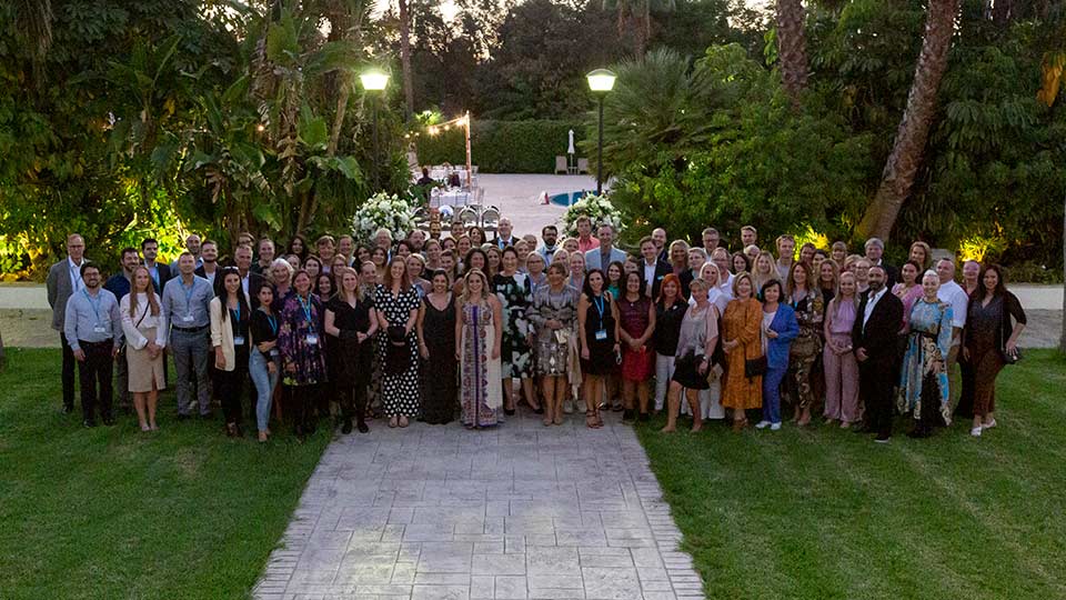 A group of people posing for a group photo at the Cryos Symposium 2021 in Cyprus
