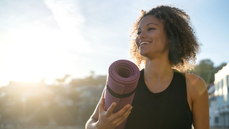 A healthy women on her way to yoga