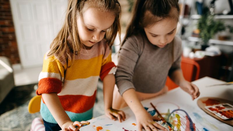 Two donor-conceived children drawing