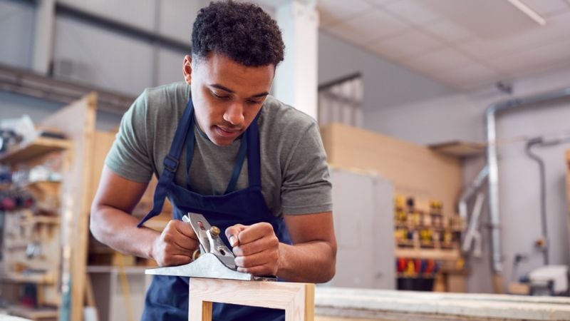 Young man in a workshop Young man in a workshop