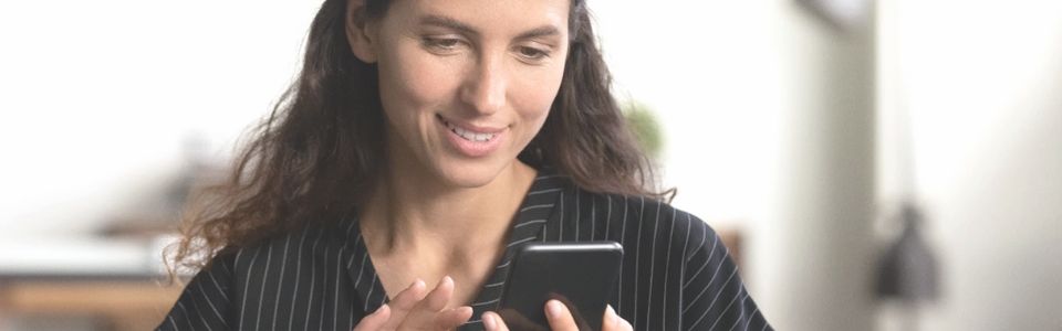 Single mother by choice looking at her phone