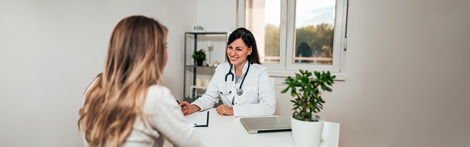 A potential egg donor being counselled by a doctor A potential egg donor being counselled by a doctor